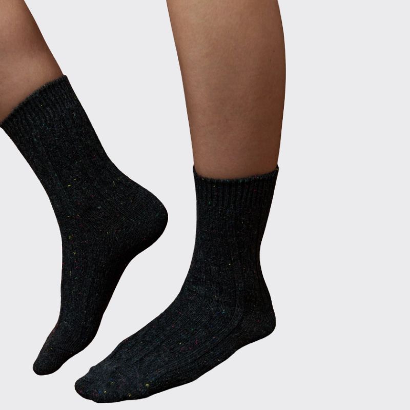 Black ribbed crew socks with colourful fleck knit worn by model showing soft comfortable everyday knit fabric.