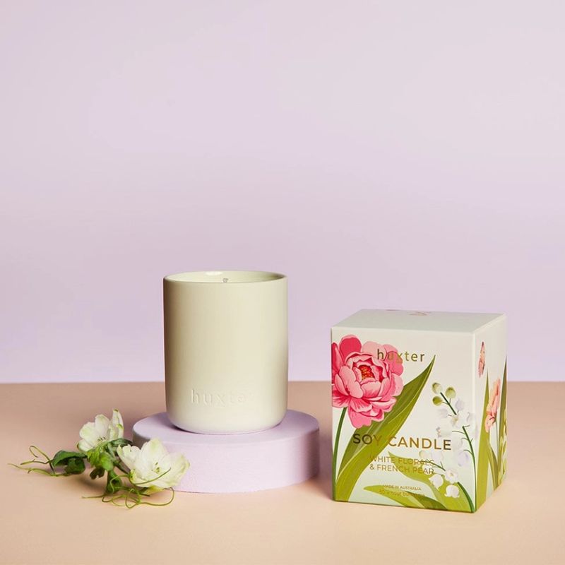 Huxt er White Florals & French Pear soy candle in matte vessel with floral gift box packaging, Australian made luxury home fragrance.