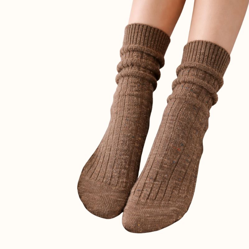 Brown ribbed slouch crew socks with fleck knit detail worn by model showing soft cozy knit fabric and relaxed everyday style.