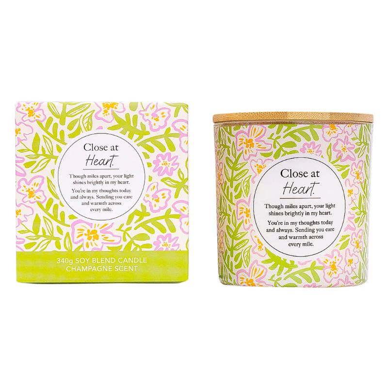 Close at Heart soy blend candle with floral packaging and champagne scent, presented in gift box and candle jar.