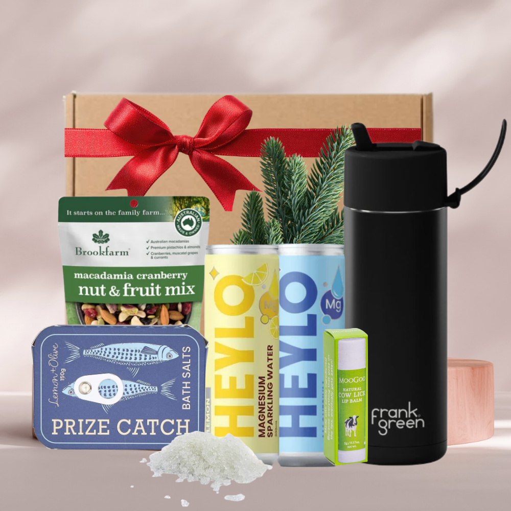 Cool Yule Christmas gift box with a Frank Green ceramic bottle, Heylo magnesium water, bath salts, MooGoo lip balm and nut mix
