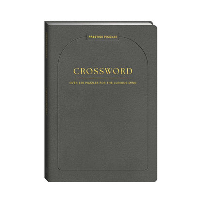 Prestige Crossword Puzzle Book in charcoal grey with gold lettering – over 130 puzzles
