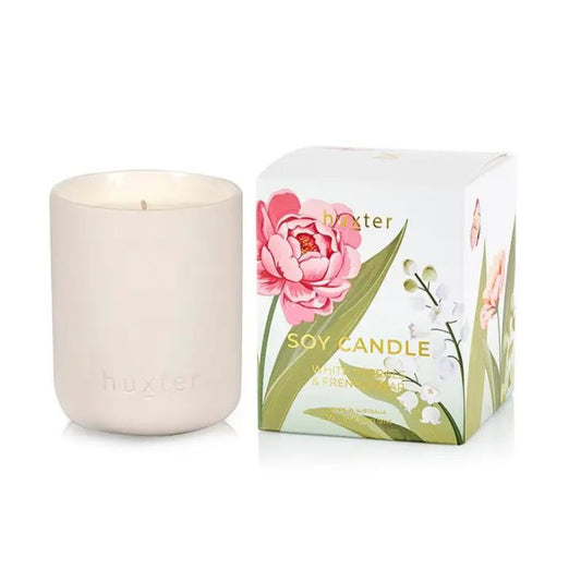 Huxt er White Florals & French Pear soy candle in matte vessel with floral gift box packaging, Australian made luxury home fragrance.