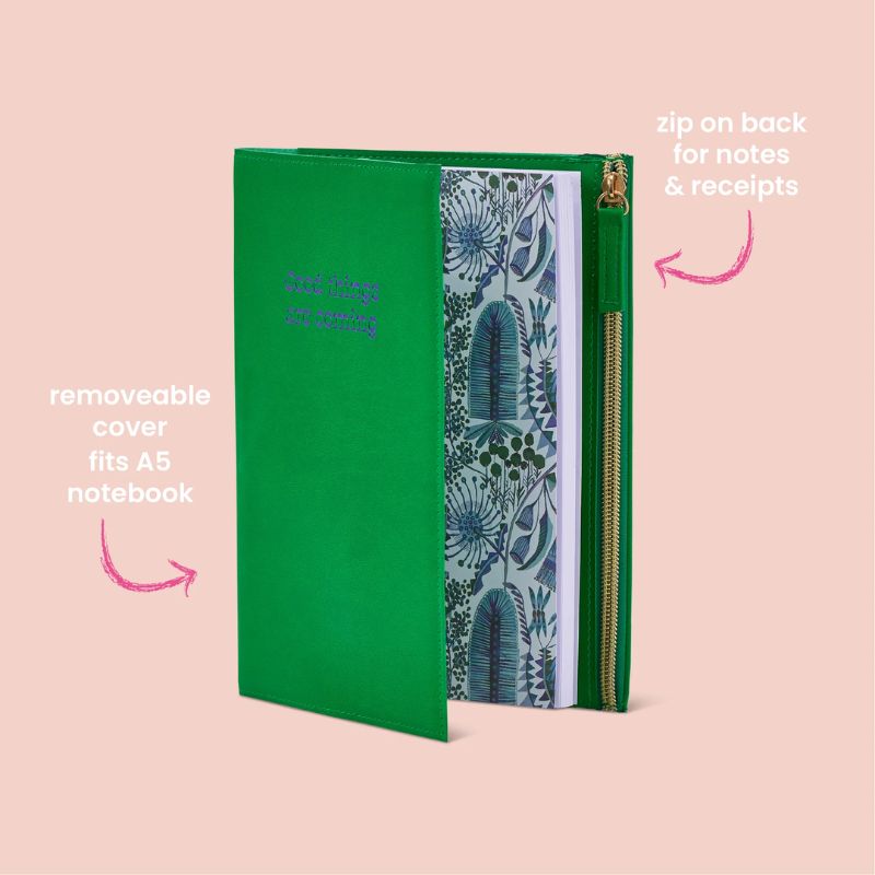 Green zip notebook with inspirational quote “Good Things Are Coming” embossed on the cover.