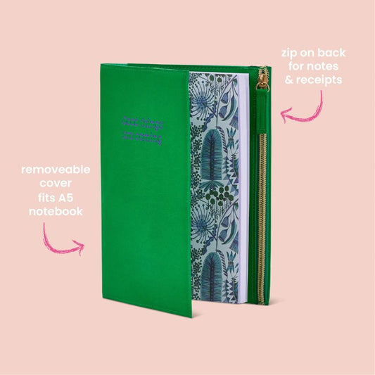 Green zip notebook with inspirational quote “Good Things Are Coming” embossed on the cover.