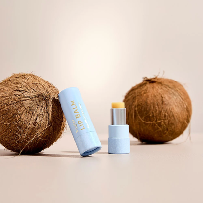 Huxter Island Coconut Lip Balm in a wind-up tube, natural vegan lip care enriched with Vitamin E, jojoba oil, and avocado oil.