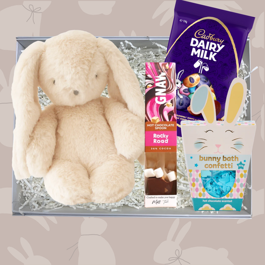 The Easter Bunny Gift Box for kids with Alimrose cuddly bunny soft toy, GNAW rocky road hot chocolate spoon, Cadbury mini Easter eggs and bunny bath soap confetti