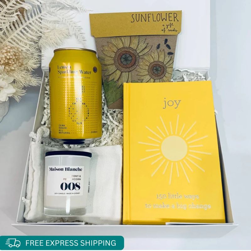 Gift some joy with this fantastic mini, Sunflower seeds by Sow N Sow, Lemon Sparling water, Devine fragranced Maison Blanche mini candle, An uplifting positive book of Joy all wrapped in a gift box by Wishing You Well