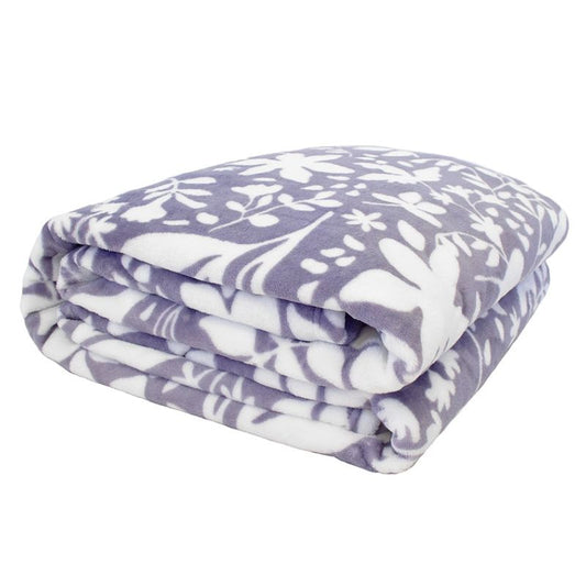 Folded lavender and white floral fleece blanket with soft plush fabric and botanical pattern.
