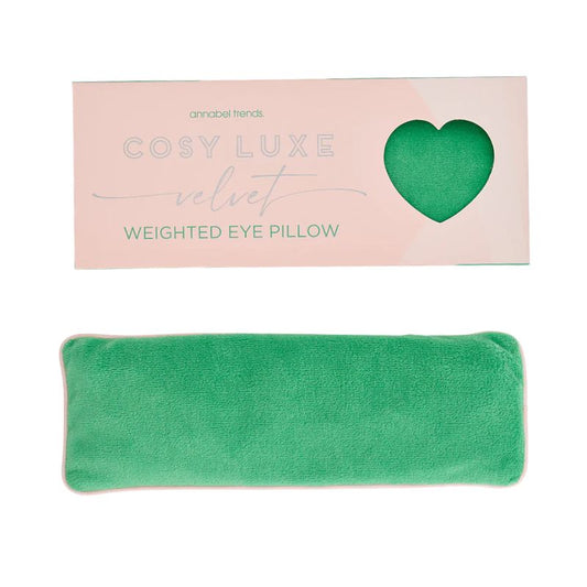 Meadow green velvet weighted eye pillow by Annabel Trends displayed below pastel packaging labeled Cosy Luxe Velvet Weighted Eye Pillow.