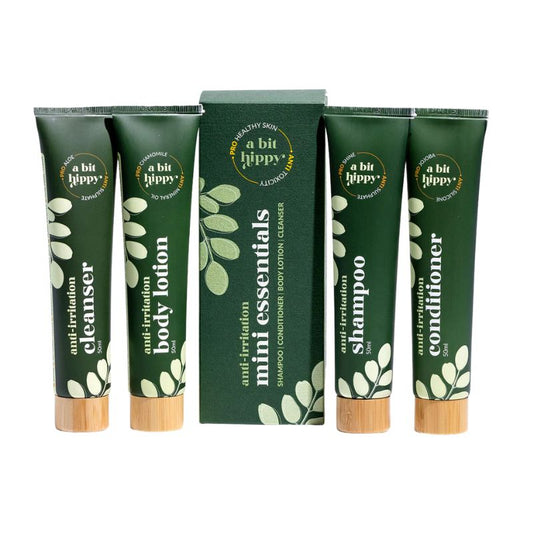 A Bit Hippy Mini Essentials travel set with shampoo, conditioner, cleanser, and body lotion