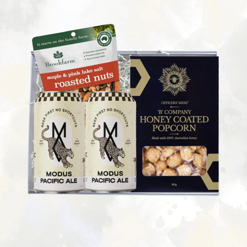The Local Brew Box gift hamper with two cans of Modus Pacific Ale, Brookfarm maple and pink lake salt roasted nuts, and Officers' Mess honey coated popcorn, packaged in a Wishing You Well gift box.