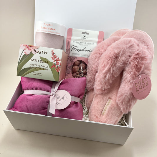 Cosy pamper gift box with slippers, bath soak, heat pillow and chocolate raspberries