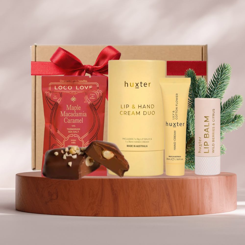 Pamper & Chocolate mini Christmas gift box with Huxter hand and lip balm set and Loco Love chocolate with red ribbon
