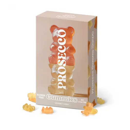 Vesper Bites Prosecco Bears gummies 100g in a blush pink box with a stack of orange and gold gummy bears printed on the front, surrounded by loose gummy bears