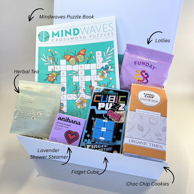 Quiet Mind Care Pack with cookies, lollies, puzzle book, lavender shower steamer, tea and a fidget toy