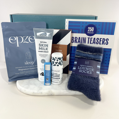 Get well gift box for men with Epzen bath salts, MooGoo skincare, Koko Black chocolate, brain teaser book and navy grippy socks