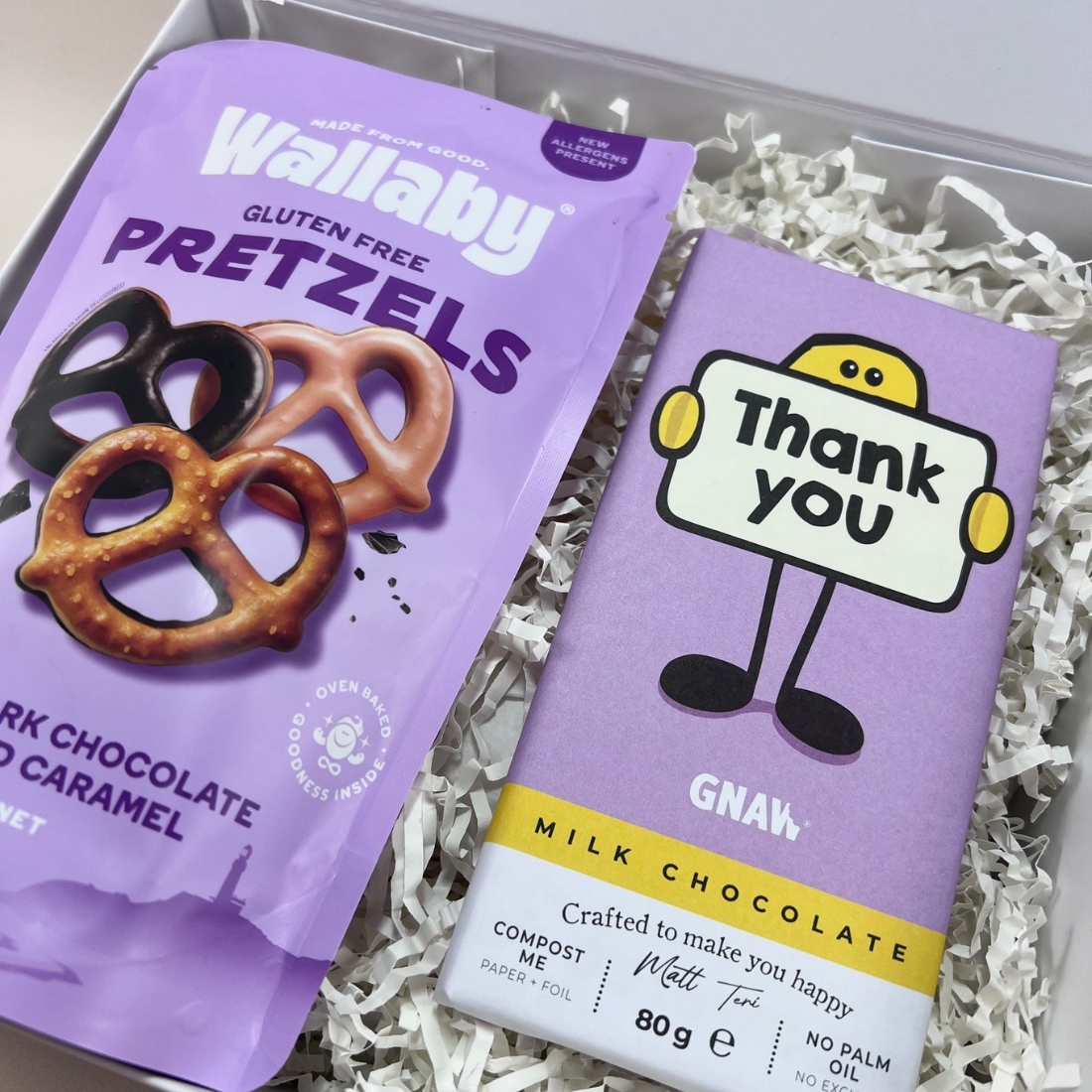 The Sweet Thanks Gift Box with Gnaw thank you milk chocolate bar and Wallaby Foods chocolate pretzels, presented in a signature gift box. Close Up