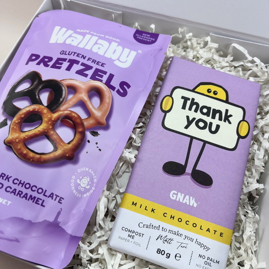 The Sweet Thanks Gift Box with Gnaw thank you milk chocolate bar and Wallaby Foods chocolate pretzels, presented in a signature gift box. Close Up