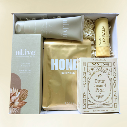 Luxury pamper gift box featuring candles, bath products, and treats from The Luxe Lounge – perfect relaxation and self-care gift.
