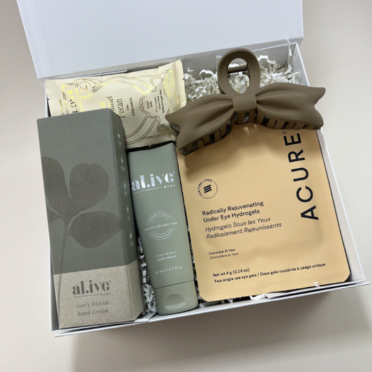 The Treat Yourself Gift Box with Al.ive Body ivory bloom hand cream, Acure under eye hydrogels, bow hair clip and Loco Love chocolate in a white gift box