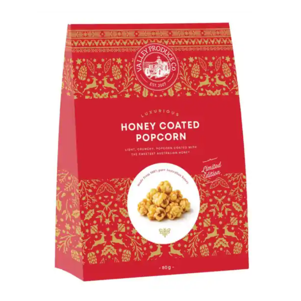 Valley Produce Co. honey coated popcorn 80g in a red and gold limited edition Christmas tent box with leaping reindeer and a picture of golden popcorn on the front