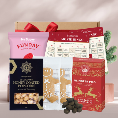 Christmas Movie Night gift box with movie bingo cards, honey popcorn, Reindeer Poo chocolate raspberries, lollies and gingerbread men
