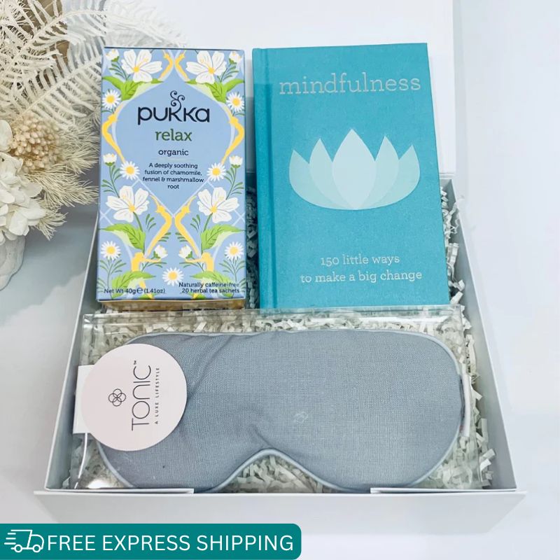Little box of calm care package. mindfulness book, linen eye mask and relaxing tea.