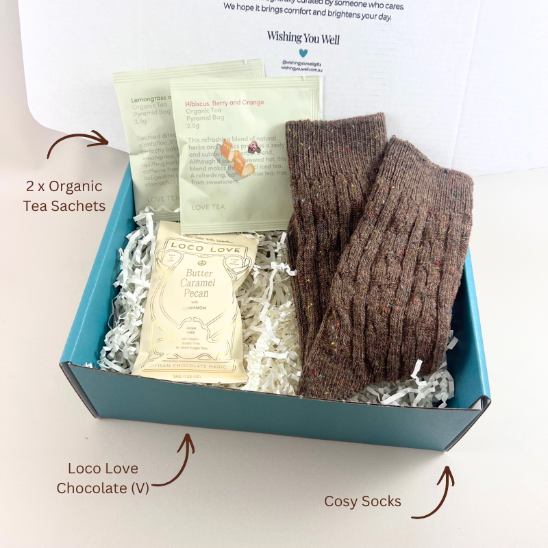 The Little Cosy Gift Box with cosy socks, Loco Love chocolate bar and two organic Love Tea sachets in a signature gift box With labels