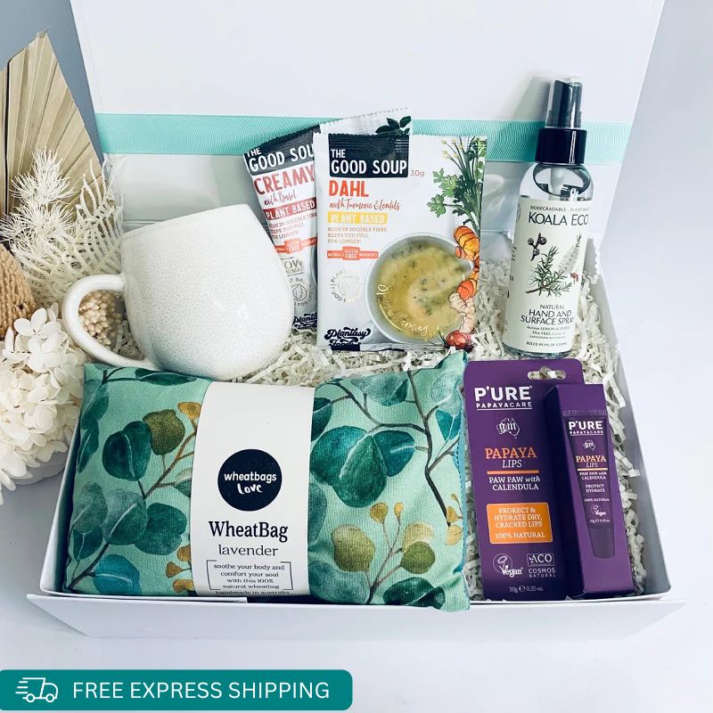 The Caregiver care box is a fantastic all in one gift, cozy up wherever you are with a warming heat pillow by wheatbags love, Use your new mug to make some yummy soup, Koala Eco Hand & Surface spray to knock those germs down, bring moisture to your lips using Papaya lips all packaged in a gift box by Wishing You Well