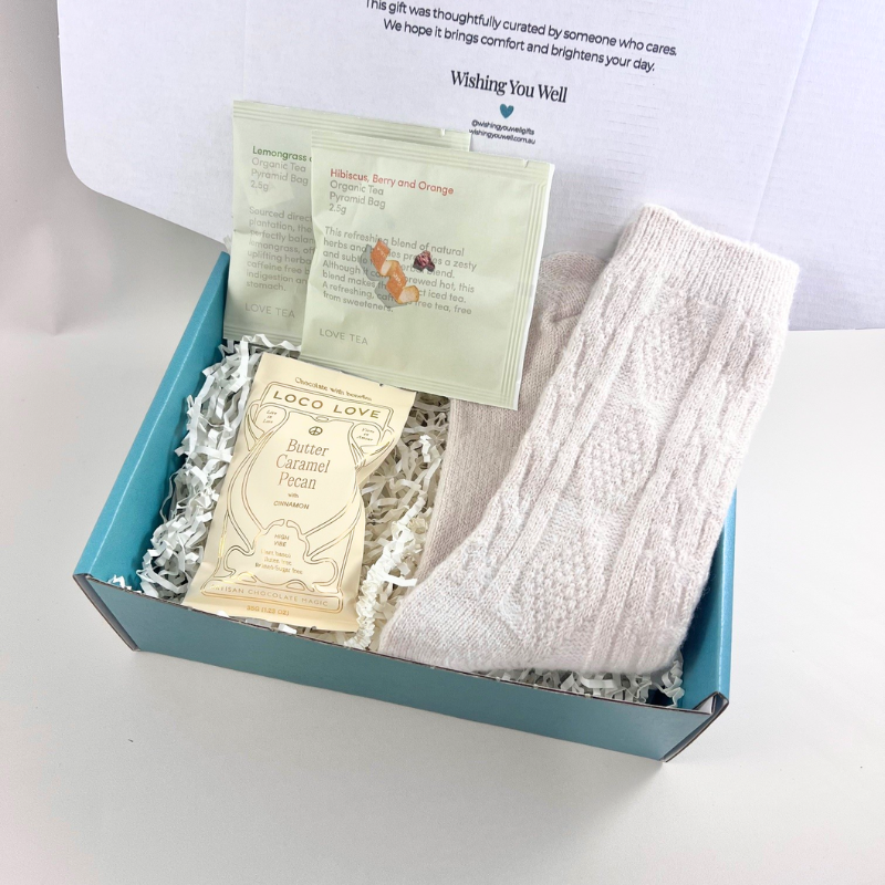 The Little Cosy Gift Box with cosy socks, Loco Love chocolate bar and two organic Love Tea sachets in a signature gift box